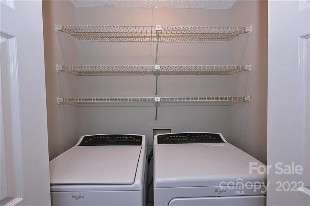 226 Queens Road, Unit 78 Charlotte, NC 28204 - Photo 30 of 32 a close view of a utility room with washer and dryer