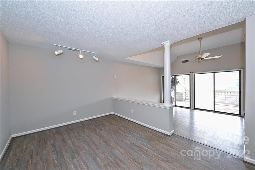 226 Queens Road, Unit 78 Charlotte, NC 28204 - Photo 7 of 32 wooden floor in an empty room with a window