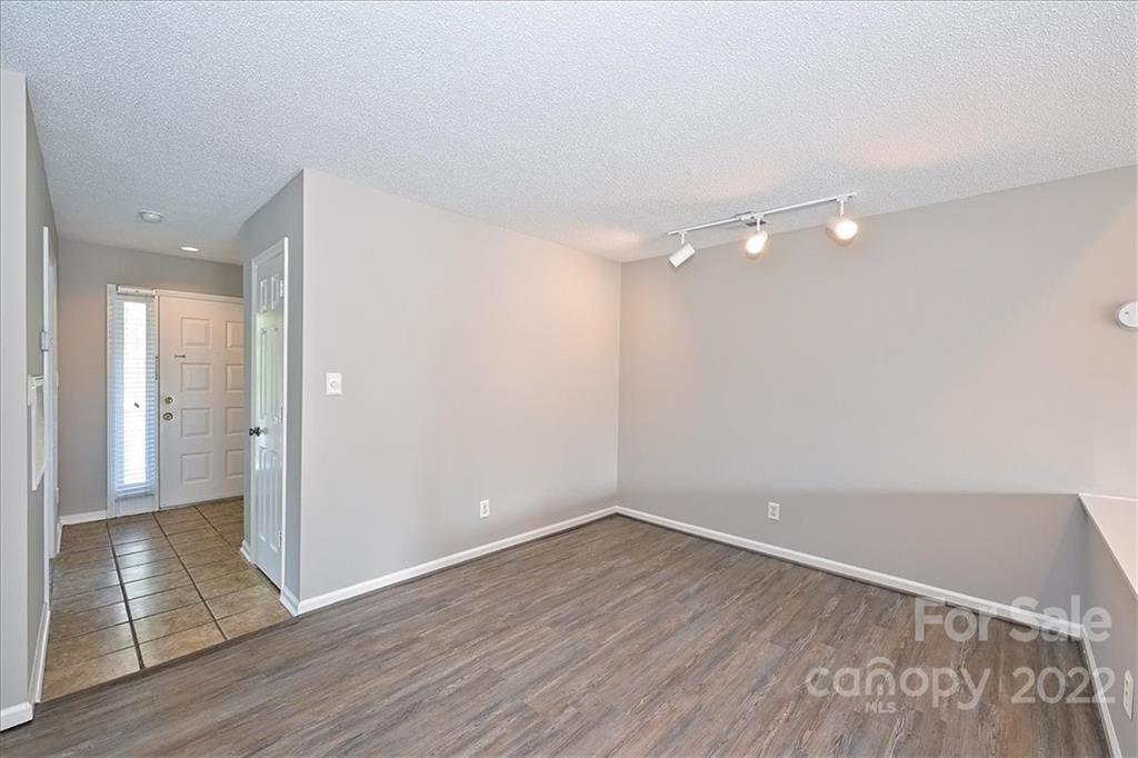 226 Queens Road, Unit 78 Charlotte, NC 28204 - Photo 8 of 32 a view of a room with wooden floor