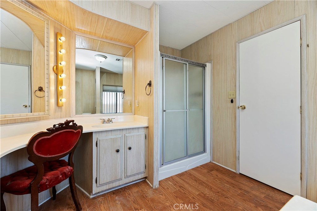 1630 Sonora Drive Hemet, CA 92543 - Photo 14 of 22 a spacious bathroom with a granite countertop sink a mirror and a shower