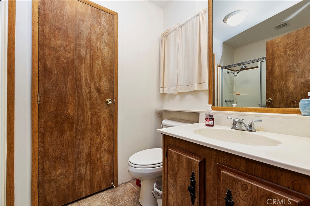 1630 Sonora Drive Hemet, CA 92543 - Photo 16 of 22 a bathroom with a sink a toilet and shower