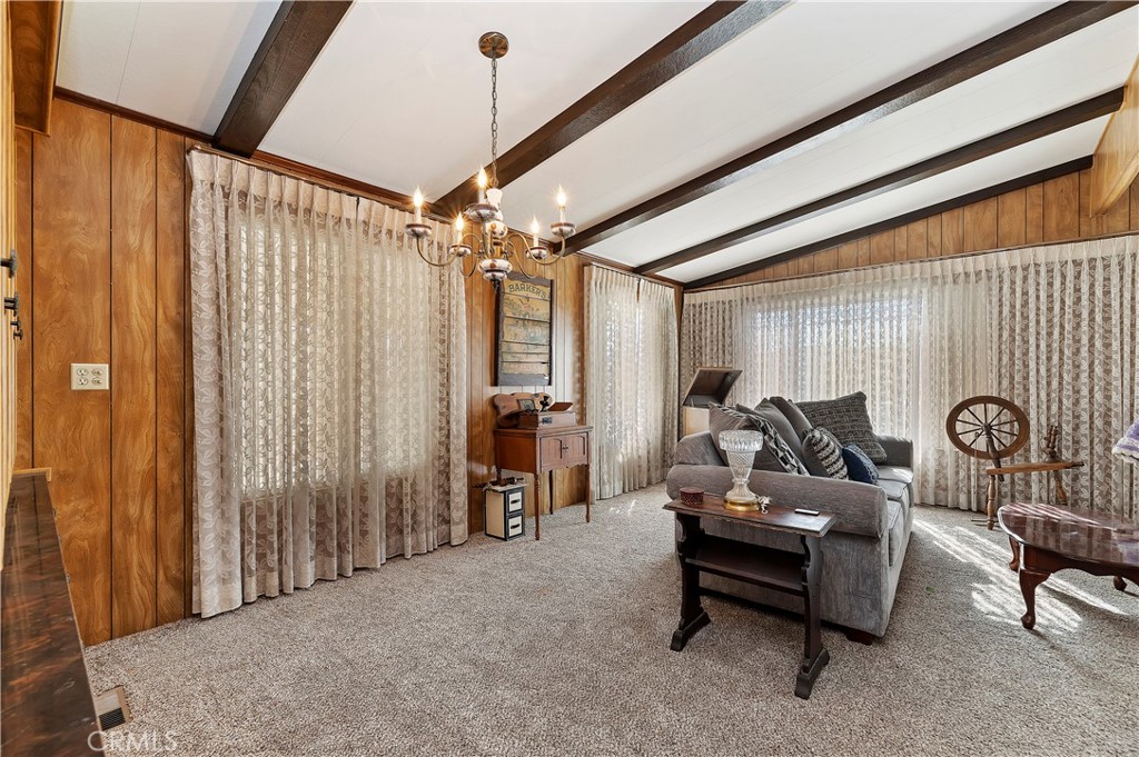 1630 Sonora Drive Hemet, CA 92543 - Photo 6 of 22 a living room with furniture a ceiling fan and a window