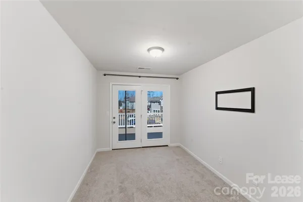a view of a hallway with closet