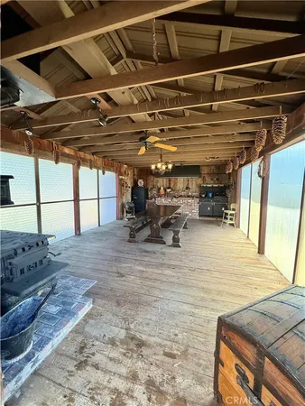 a view of balcony with wooden floor and outdoor seating