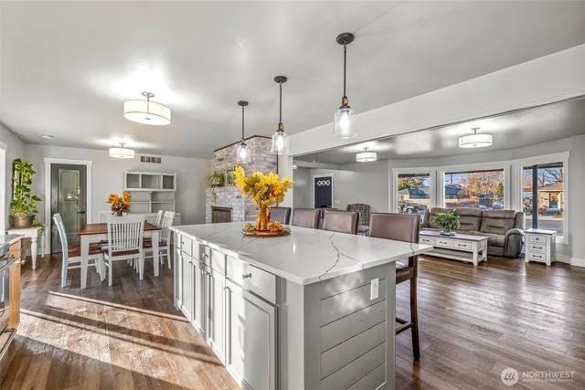 an open kitchen with a table and chairs