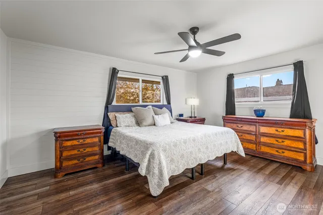 a bedroom with a bed and a dresser