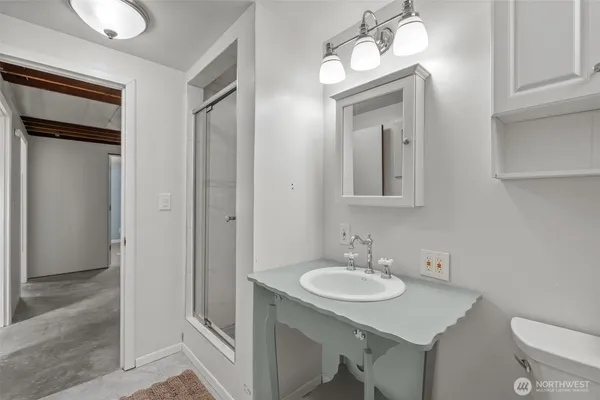 a bathroom with a sink and a mirror