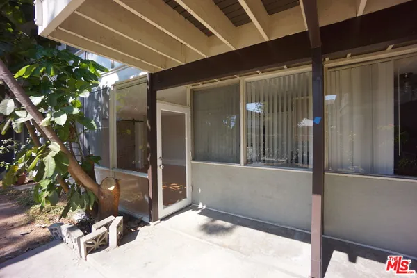 a view of a porch with seating space