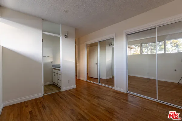 a bathroom with a sink and cabinets