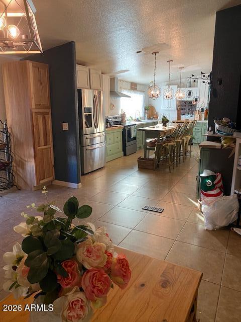 21301 West Dove Valley Road Wittmann, AZ 85361 - Photo 13 of 17 a kitchen with stainless steel appliances kitchen island granite countertop a sink and cabinets