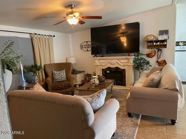 21301 West Dove Valley Road Wittmann, AZ 85361 - Photo 5 of 17 a living room with furniture a flat screen tv and a fireplace