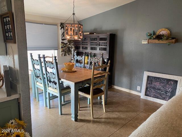 21301 West Dove Valley Road Wittmann, AZ 85361 - Photo 8 of 17 a dining room with furniture and chandelier