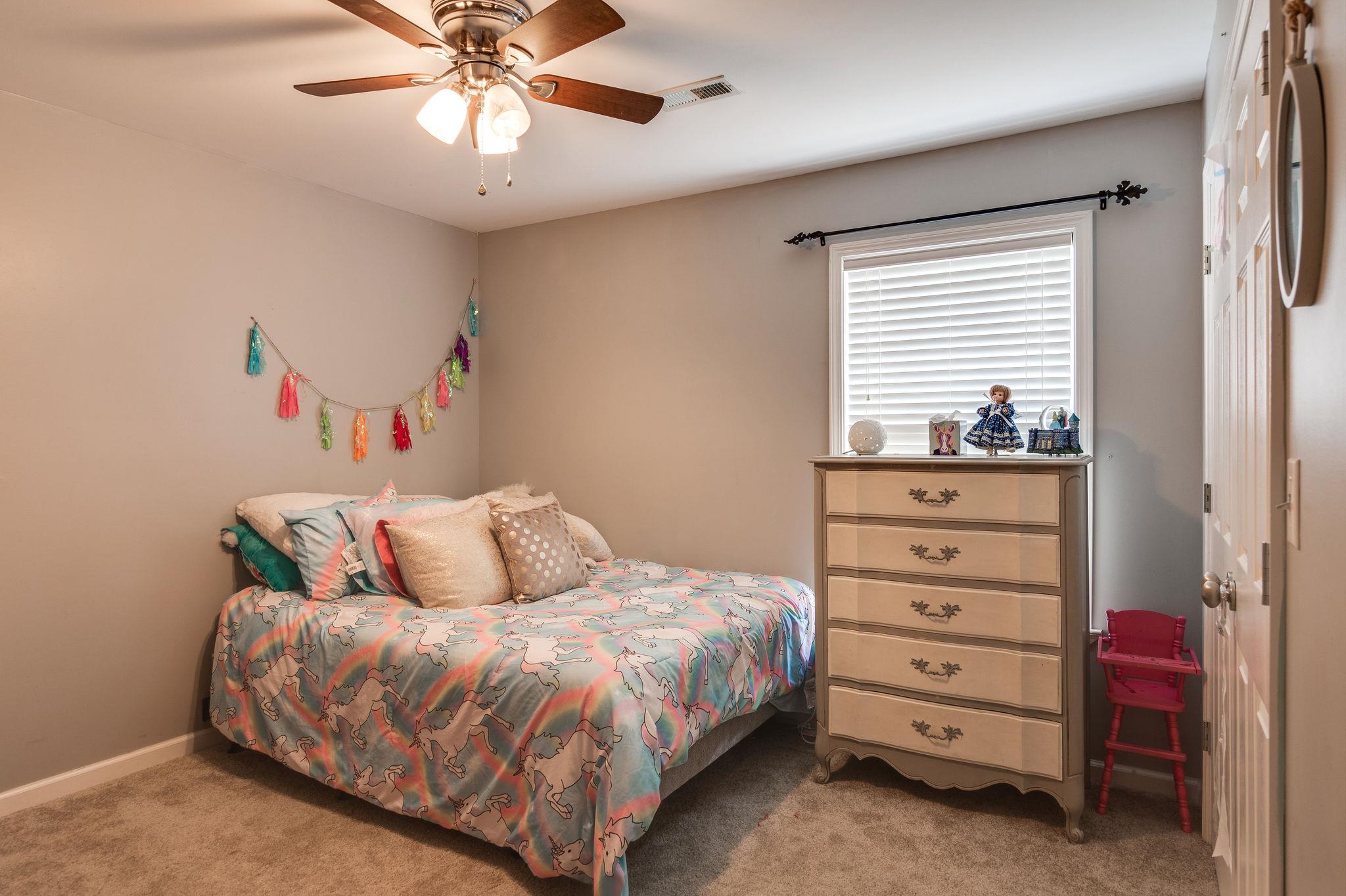 1675 Center Star Road Columbia, TN 38401 - Photo 13 of 21 a bedroom with a bed and a dresser