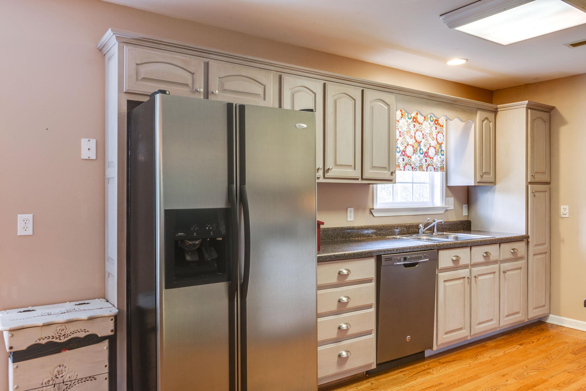 1675 Center Star Road Columbia, TN 38401 - Photo 7 of 21 a kitchen with stainless steel appliances a refrigerator sink and cabinets