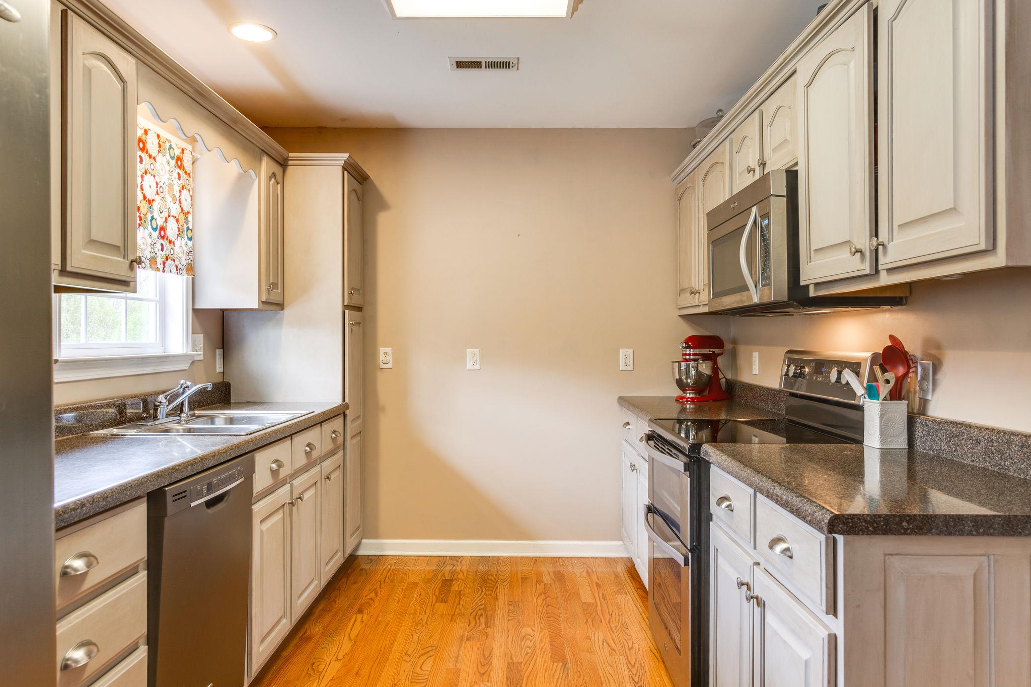 1675 Center Star Road Columbia, TN 38401 - Photo 8 of 21 a kitchen with a sink stove and cabinets
