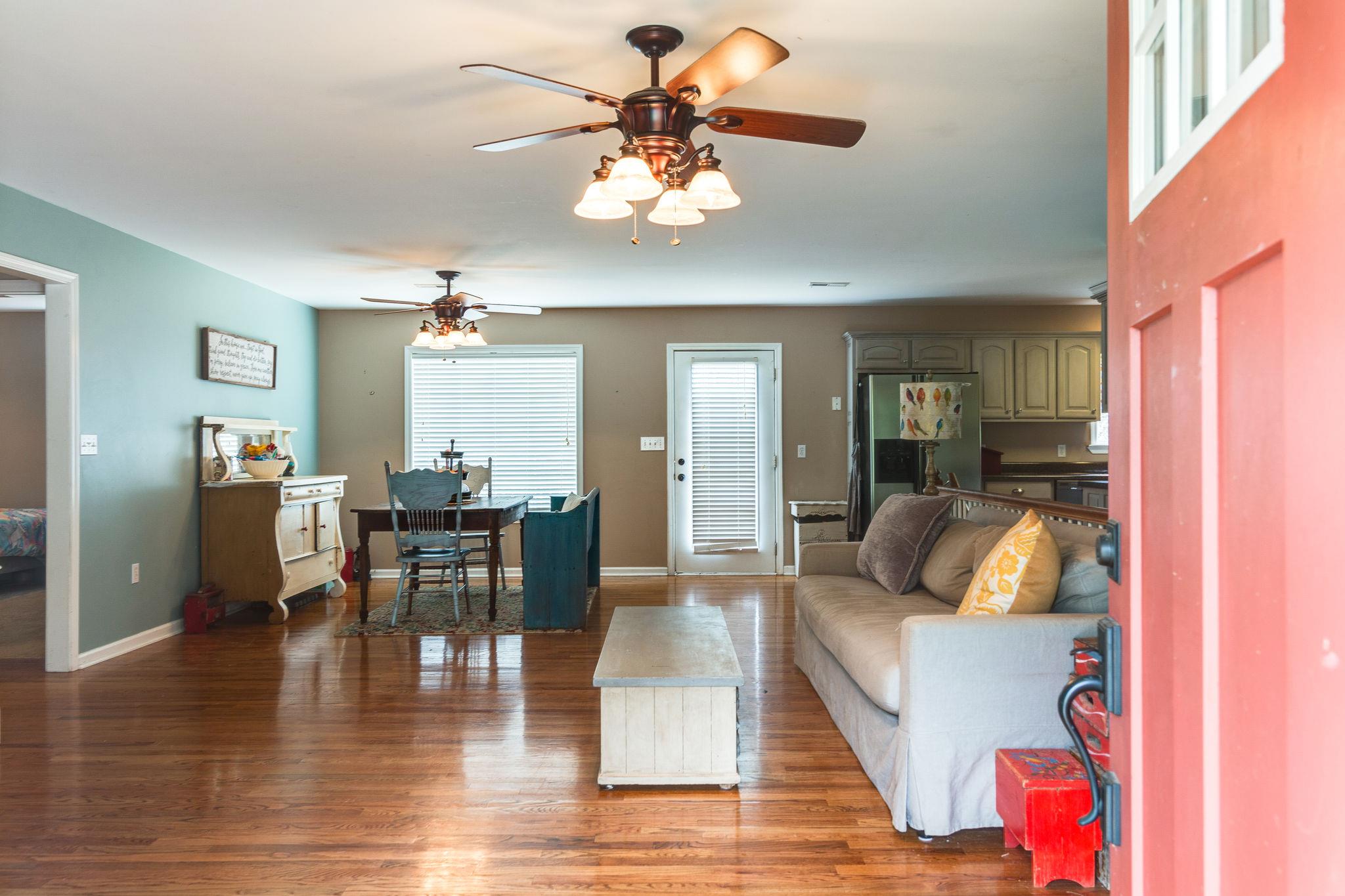 1675 Center Star Road Columbia, TN 38401 - Photo 10 of 21 a living room with furniture and a chandelier