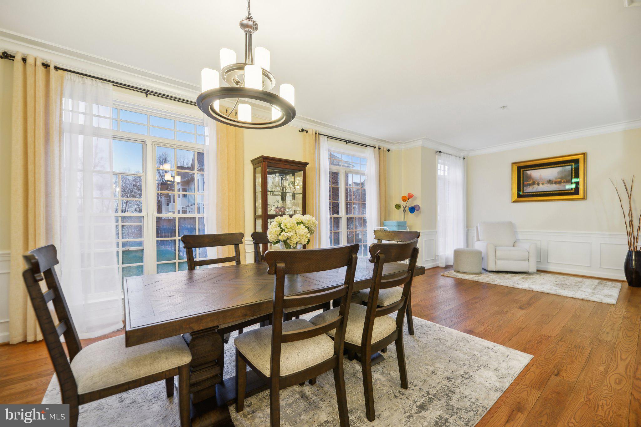 47753 Ramshead Terrace Sterling, VA 20165 - Photo 11 of 37 a view of a dining room with furniture window and wooden floor