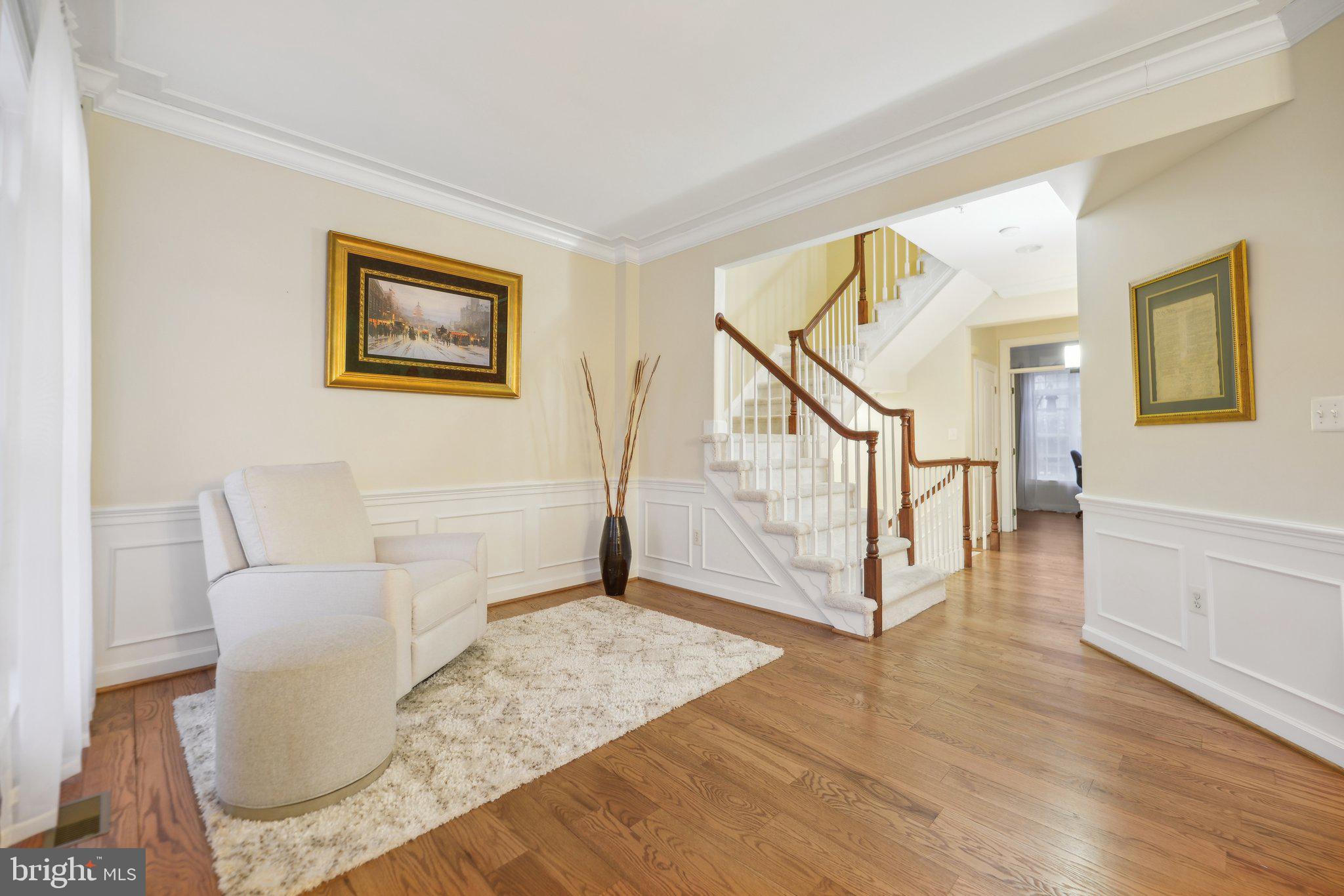 47753 Ramshead Terrace Sterling, VA 20165 - Photo 13 of 37 a view of a livingroom with an entryway and a couch