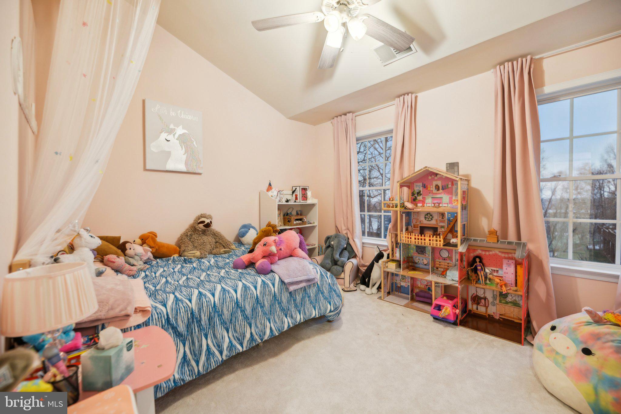 47753 Ramshead Terrace Sterling, VA 20165 - Photo 21 of 37 a bedroom with furniture and a large window
