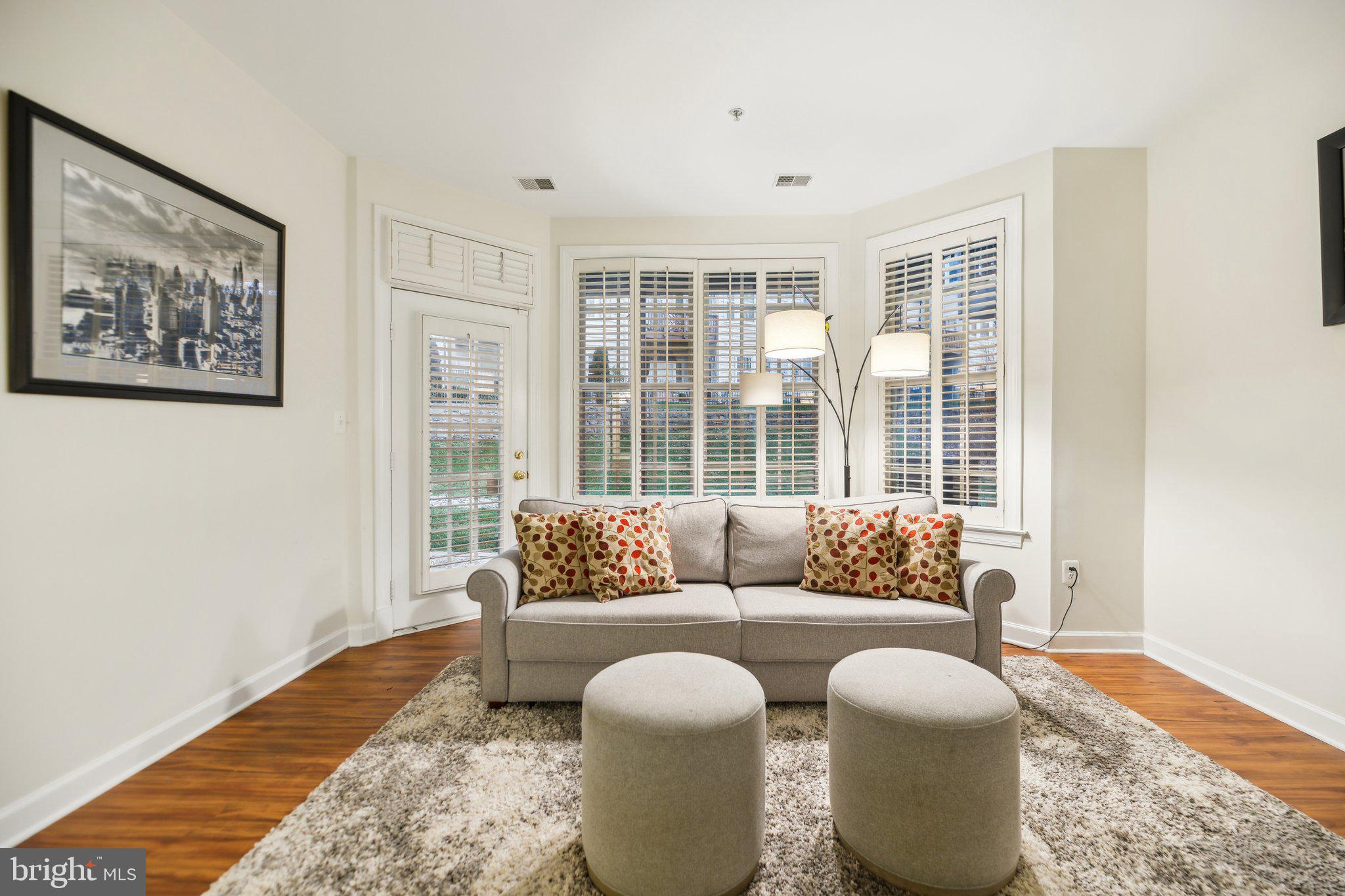47753 Ramshead Terrace Sterling, VA 20165 - Photo 24 of 37 a living room with furniture and a large window