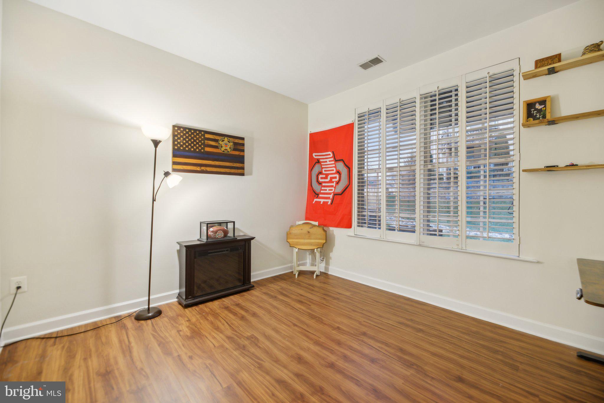 47753 Ramshead Terrace Sterling, VA 20165 - Photo 27 of 37 a view of a livingroom with wooden floor and a window