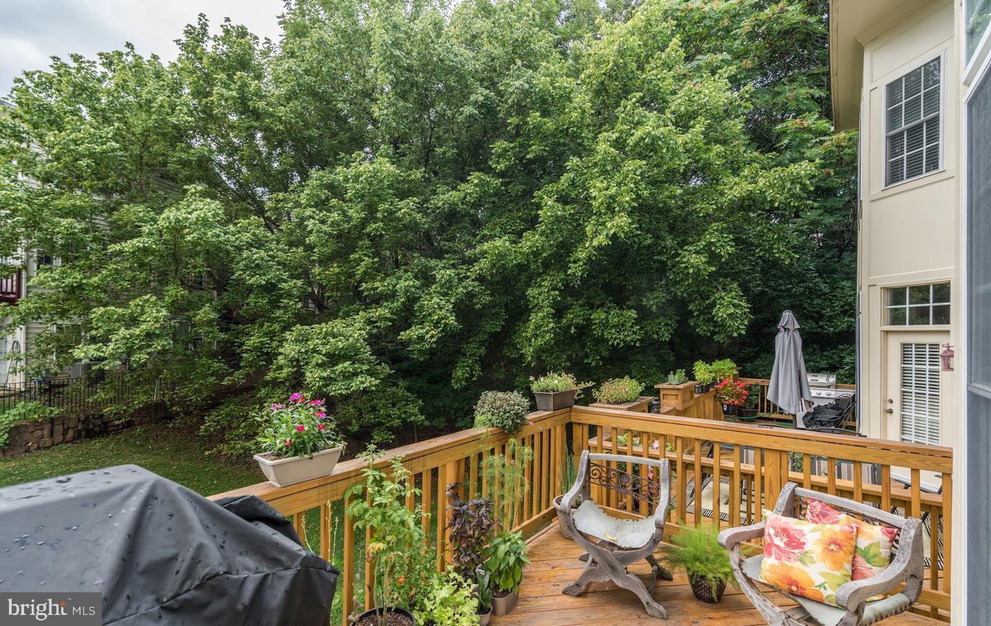 47753 Ramshead Terrace Sterling, VA 20165 - Photo 30 of 37 a view of a deck with two chairs and a table