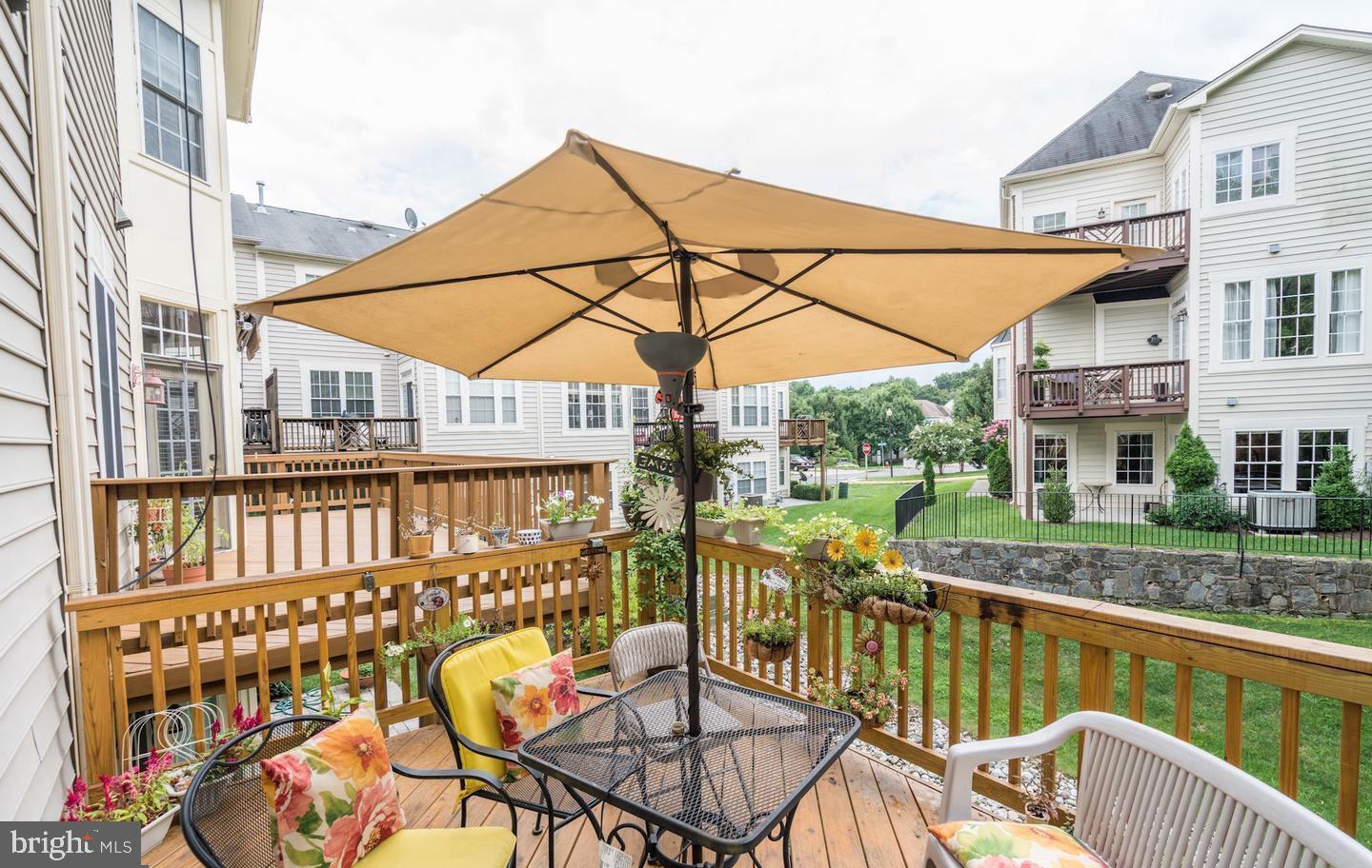 47753 Ramshead Terrace Sterling, VA 20165 - Photo 31 of 37 a view of a balcony with lake view and wooden floor