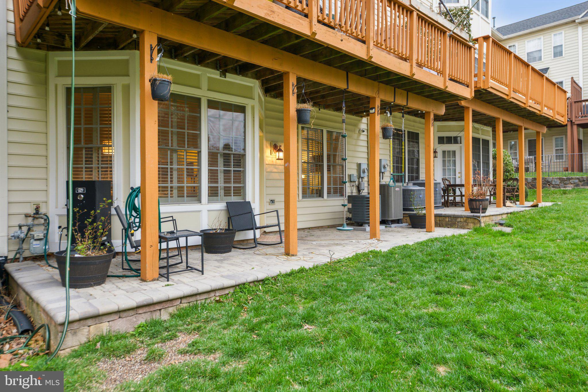 47753 Ramshead Terrace Sterling, VA 20165 - Photo 32 of 37 a view of a building with sitting area and bench