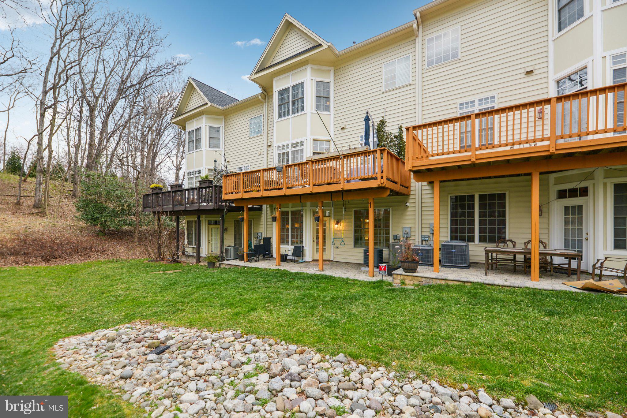 47753 Ramshead Terrace Sterling, VA 20165 - Photo 33 of 37 a view of a chairs and a table in front of house