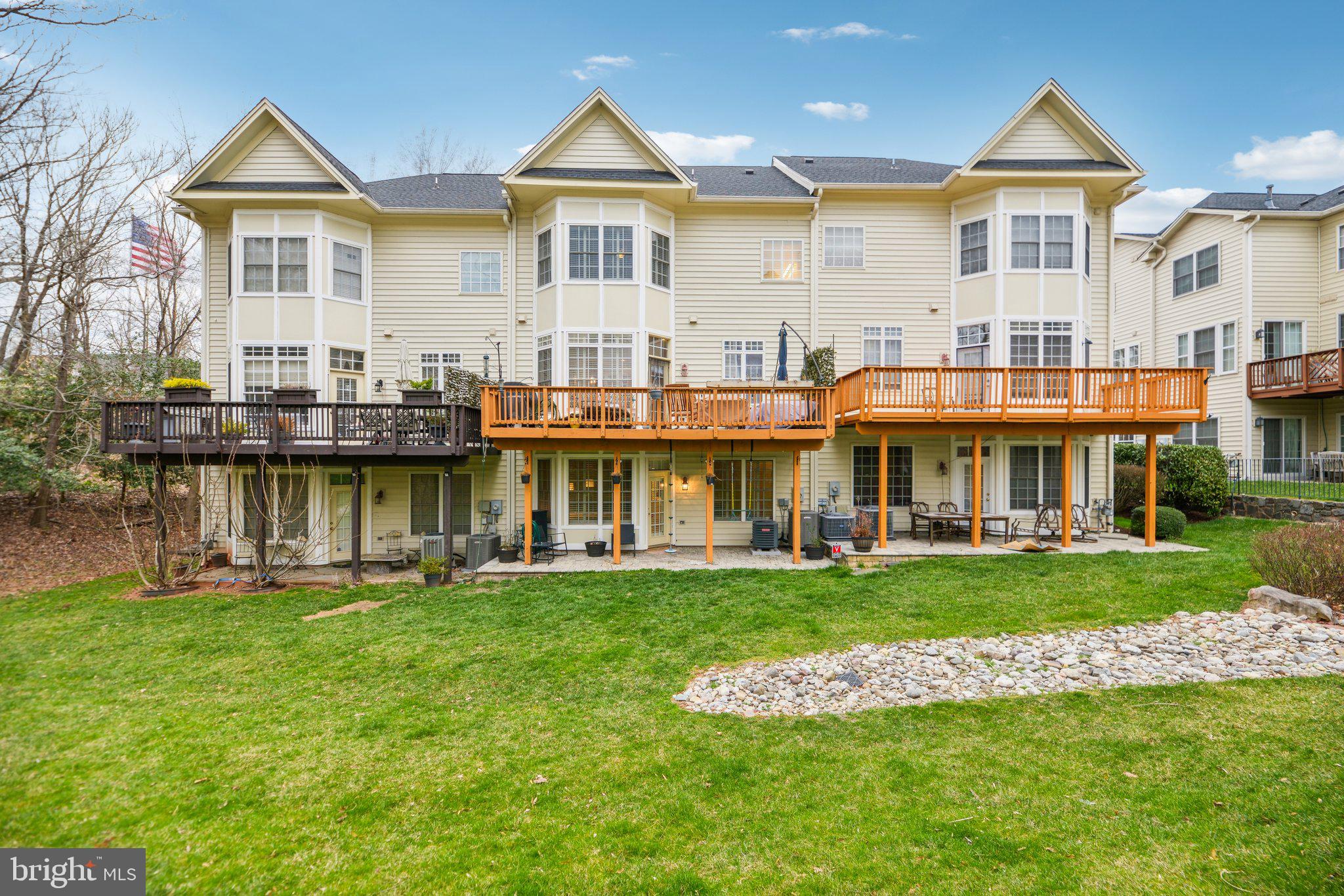 47753 Ramshead Terrace Sterling, VA 20165 - Photo 34 of 37 a front view of a house with a yard and lake view