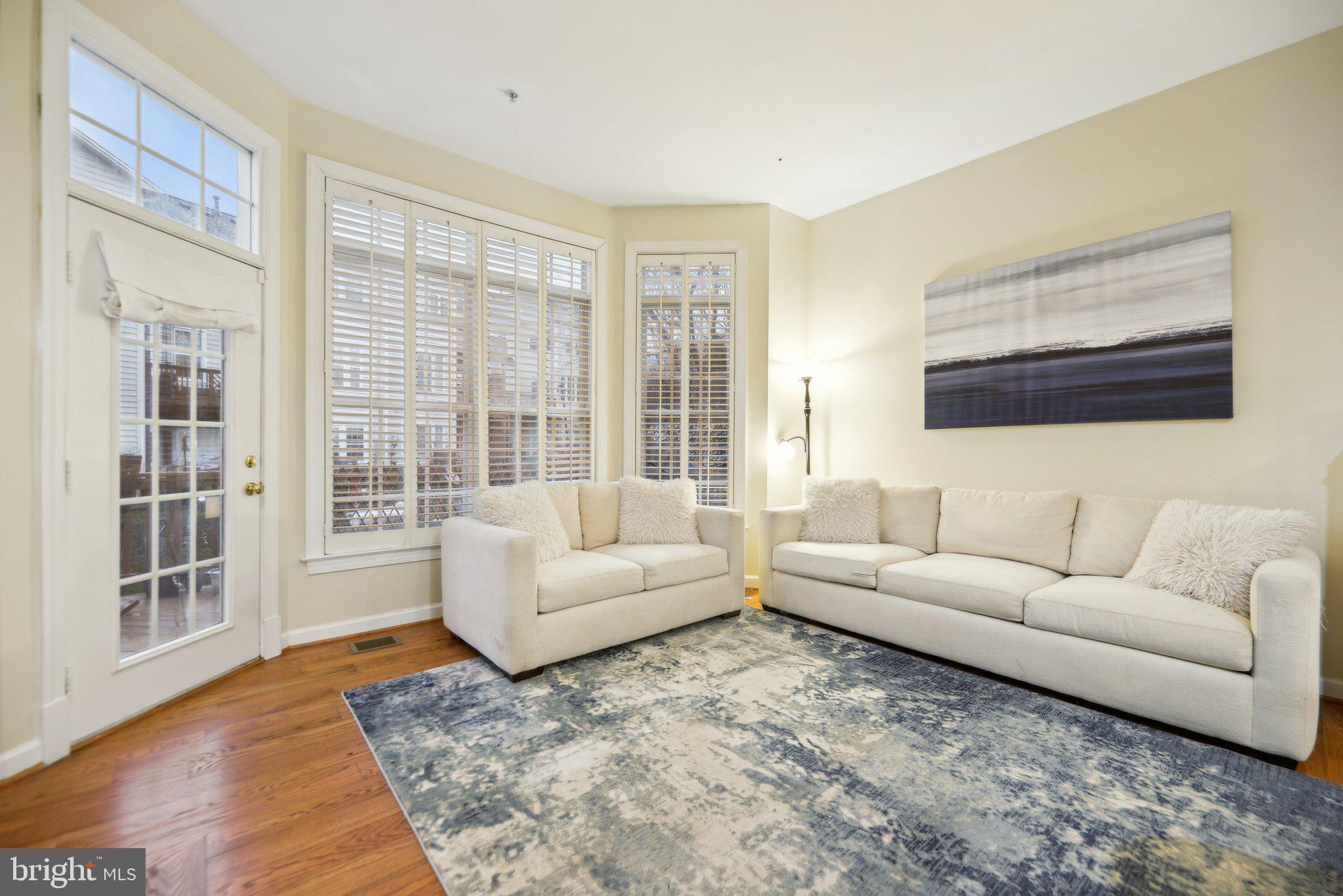 47753 Ramshead Terrace Sterling, VA 20165 - Photo 4 of 37 a living room with furniture and a large window