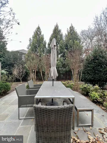 a view of a dinning table and chairs in the patio