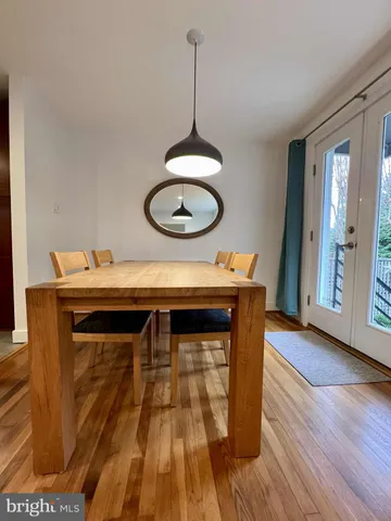 a kitchen with a wooden floor and a sink