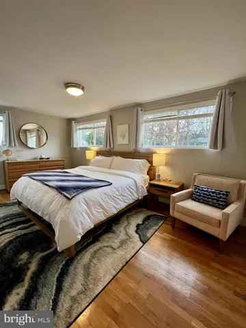 a bedroom with bed and window