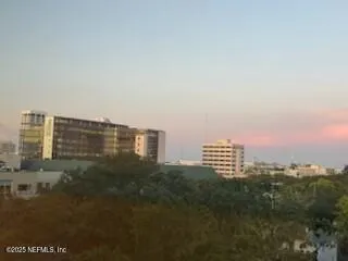 a view of a city with tall buildings