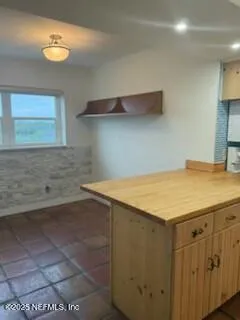 a kitchen with a stove and a microwave