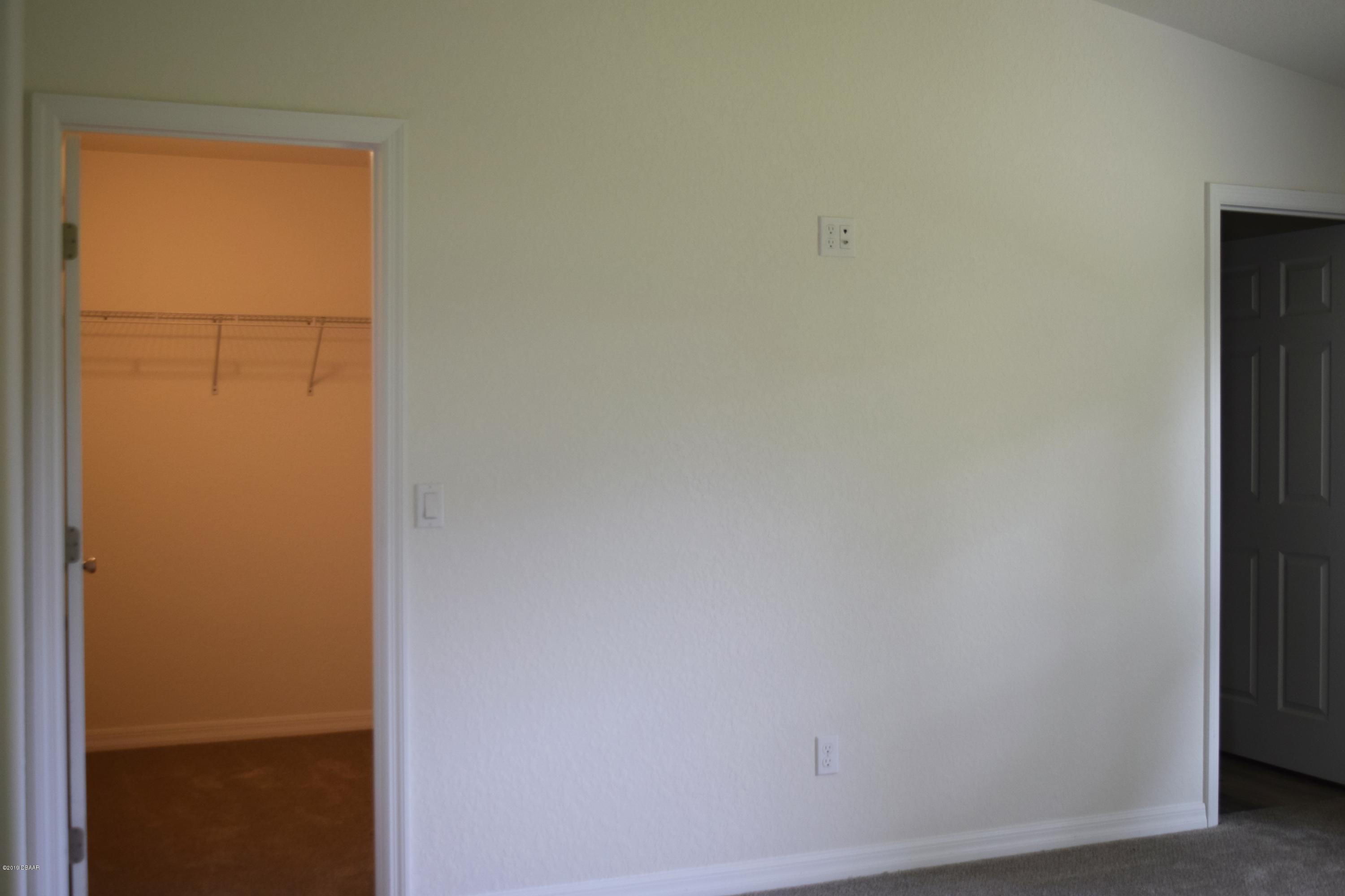 3129 Pine Tree Drive Edgewater, FL 32141 - Photo 12 of 22 master bedroom walk in closet