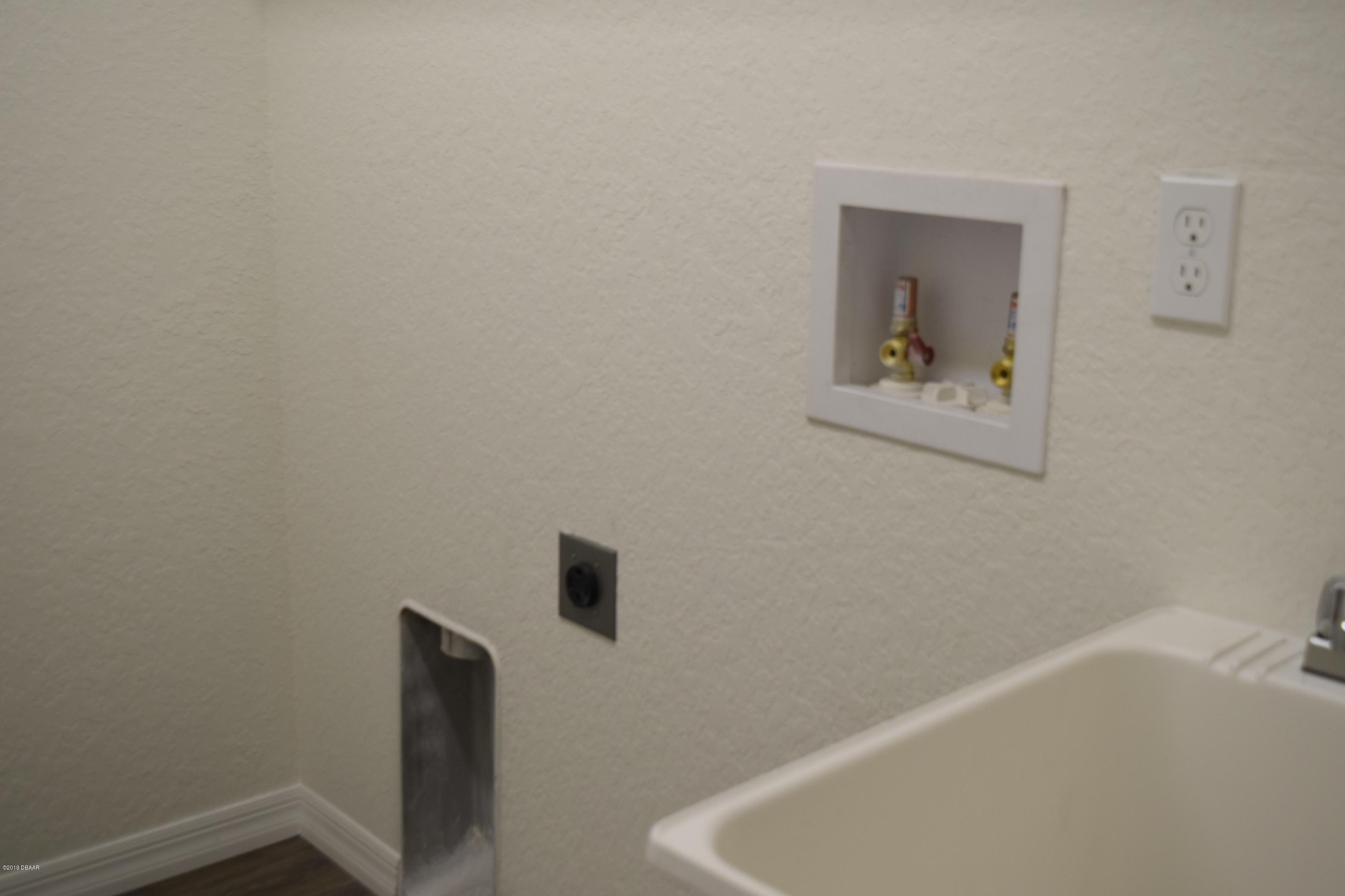 3129 Pine Tree Drive Edgewater, FL 32141 - Photo 18 of 22 inside laundry room