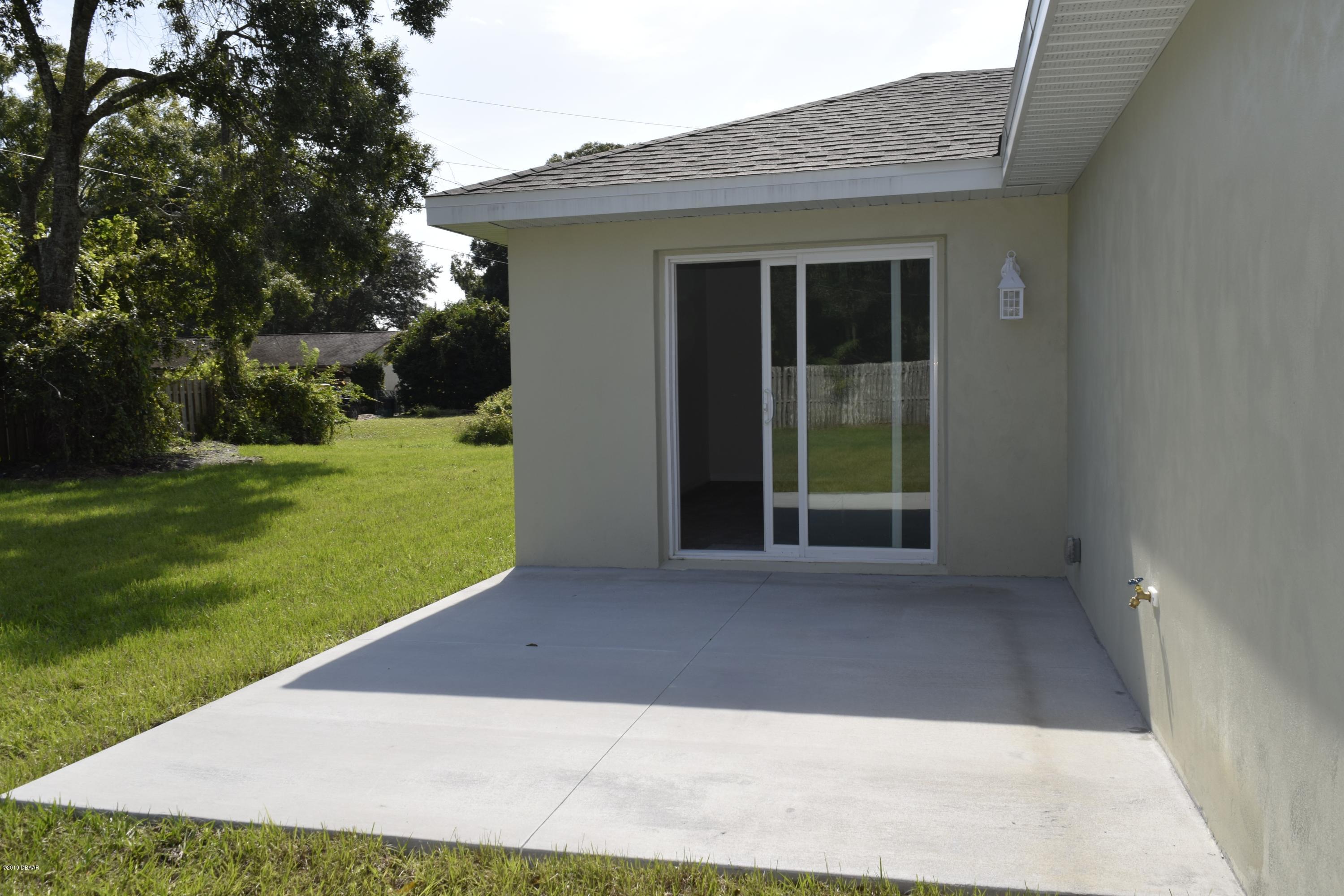 3129 Pine Tree Drive Edgewater, FL 32141 - Photo 19 of 22 patio off family room