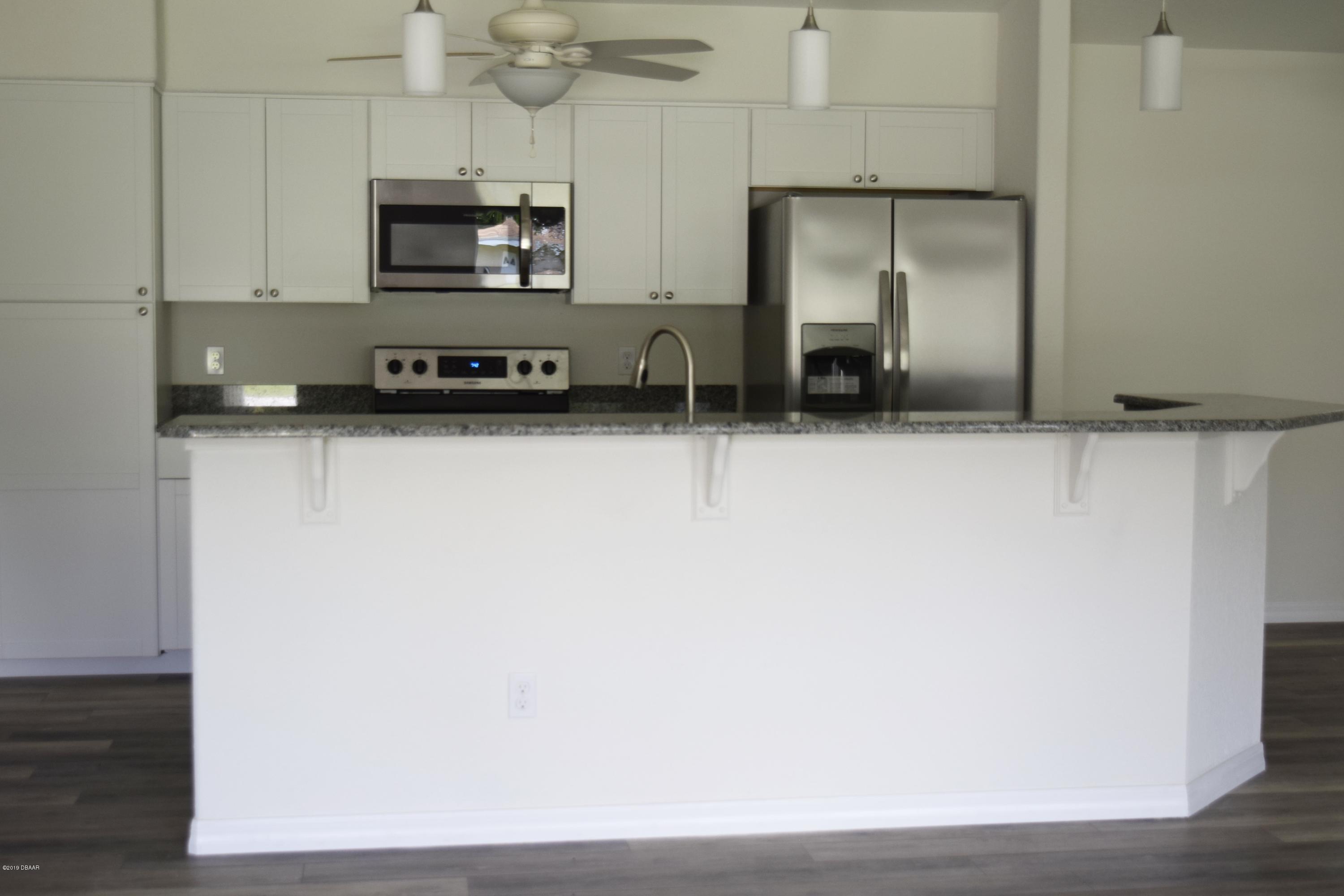 3129 Pine Tree Drive Edgewater, FL 32141 - Photo 9 of 22 Kitchen bar