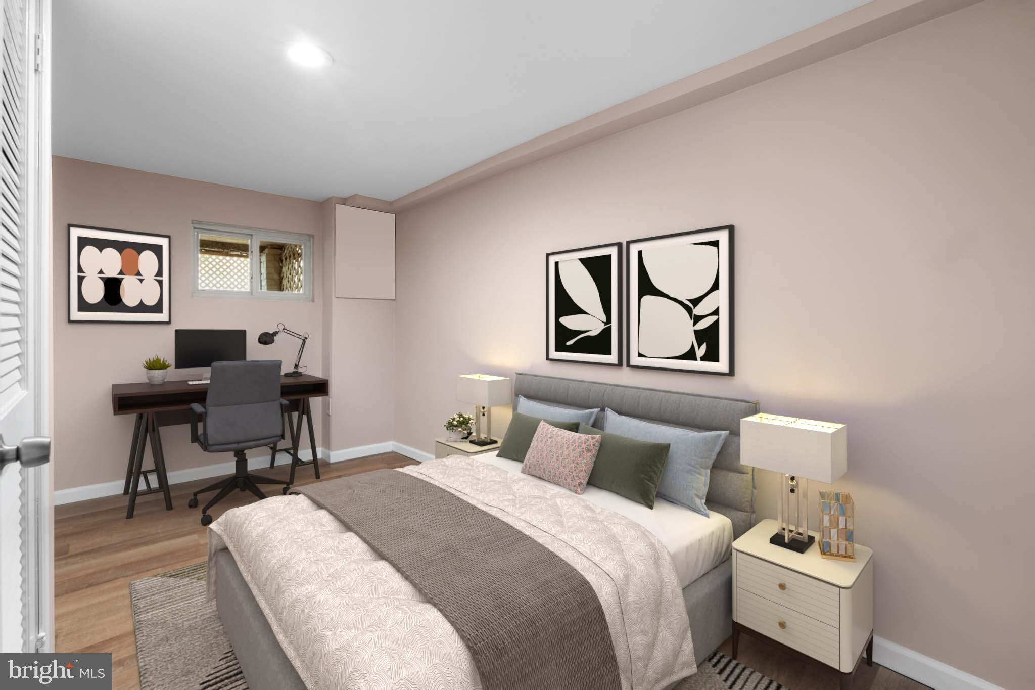 1613 R Street Southeast Washington, DC 20020 - Photo 15 of 34 a bedroom with bed and a painting on the wall