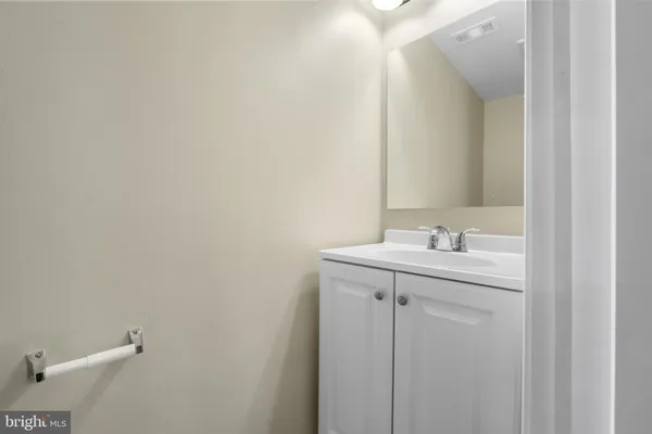 a bathroom with a sink and mirror