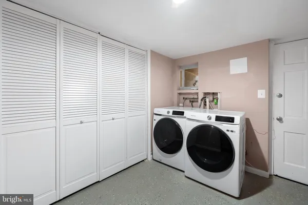 a utility room with dryer and washer