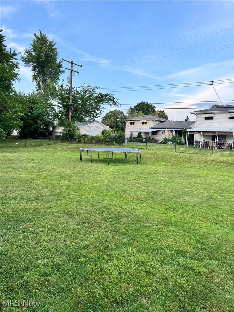 5945 Randy Road Bedford Heights, OH 44146 - Photo 2 of 13 View of yard featuring a trampoline