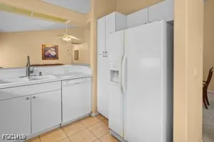 a bathroom with a double vanity sink mirror and shower