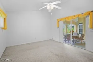 a view of dining room with furniture and a chandelier