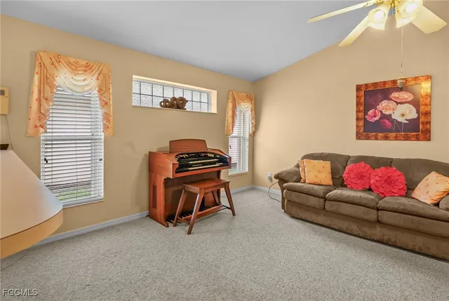a living room with furniture and a window