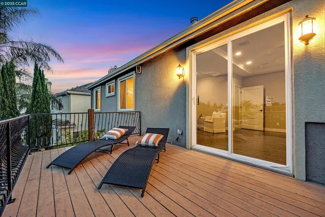 a bedroom with a bed a dresser and a window
