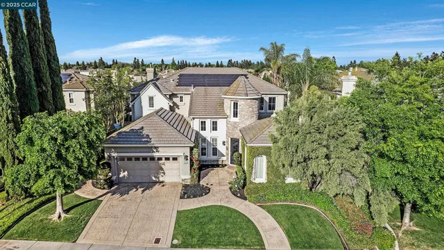 an aerial view of a house with a ocean view