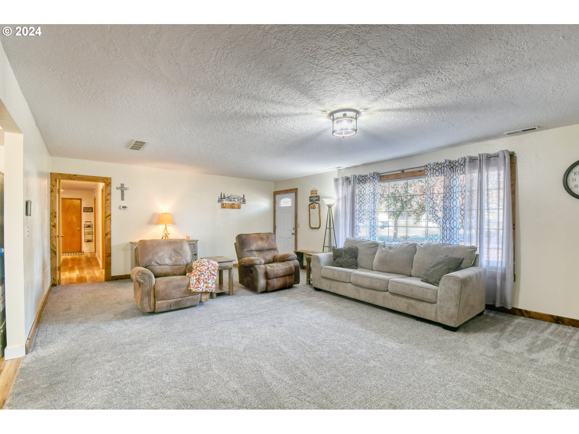 3010 Northeast Riverside Avenue Pendleton, OR 97801 - Photo 11 of 47 a living room with furniture and a large window